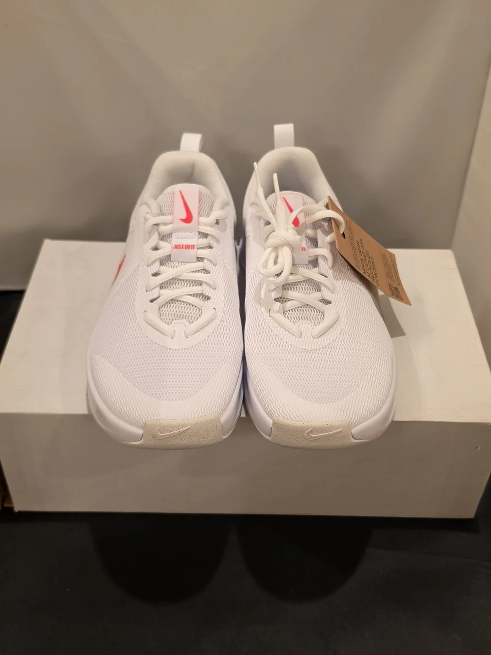 Nike Women's White Athletic Sneakers with Pink Swoosh